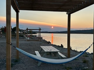 Hammock and benches at the waters edge in Spanish Ontario 